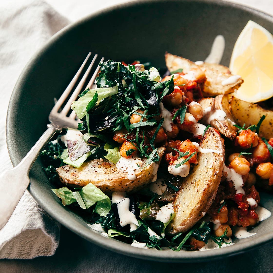 Harissa Chickpea Bowl with Potatoes, Lemony Tahini & Greens