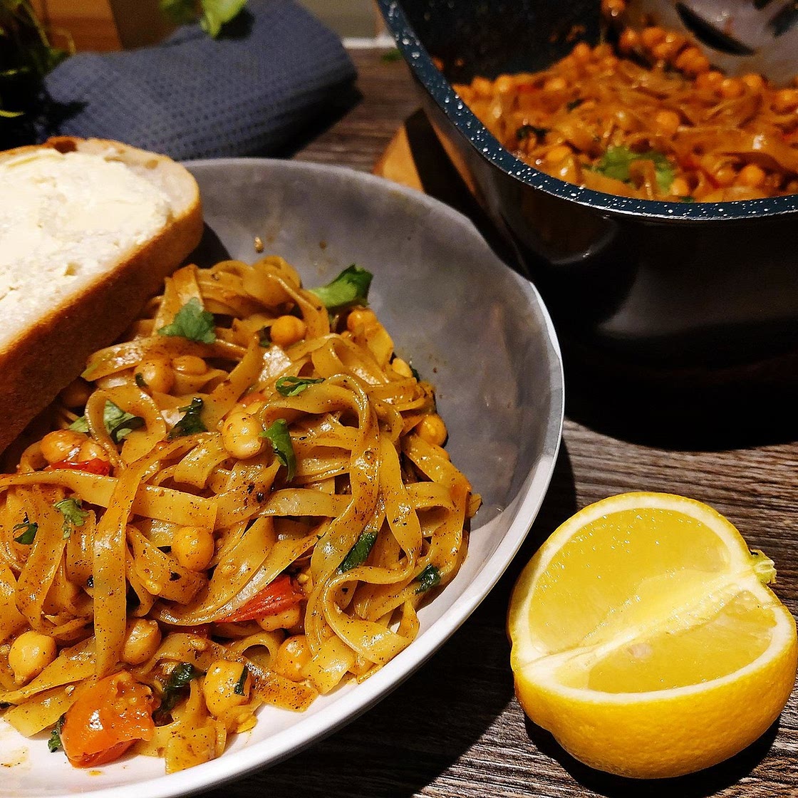 Fried Tagliatelle with Chickpeas and Tomatoes in Cajun Oil