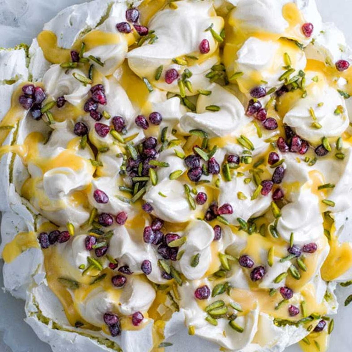 Saffron & pistachio pavlova with citrus curd