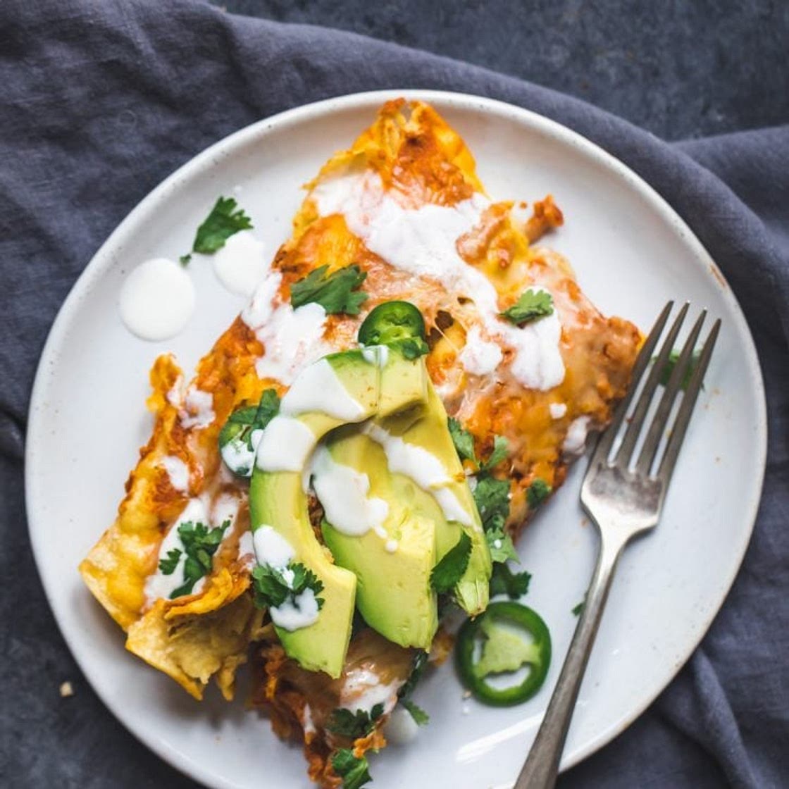 Spicy Black Bean Chicken Enchiladas with Pumpkin Sour Cream Sauce
