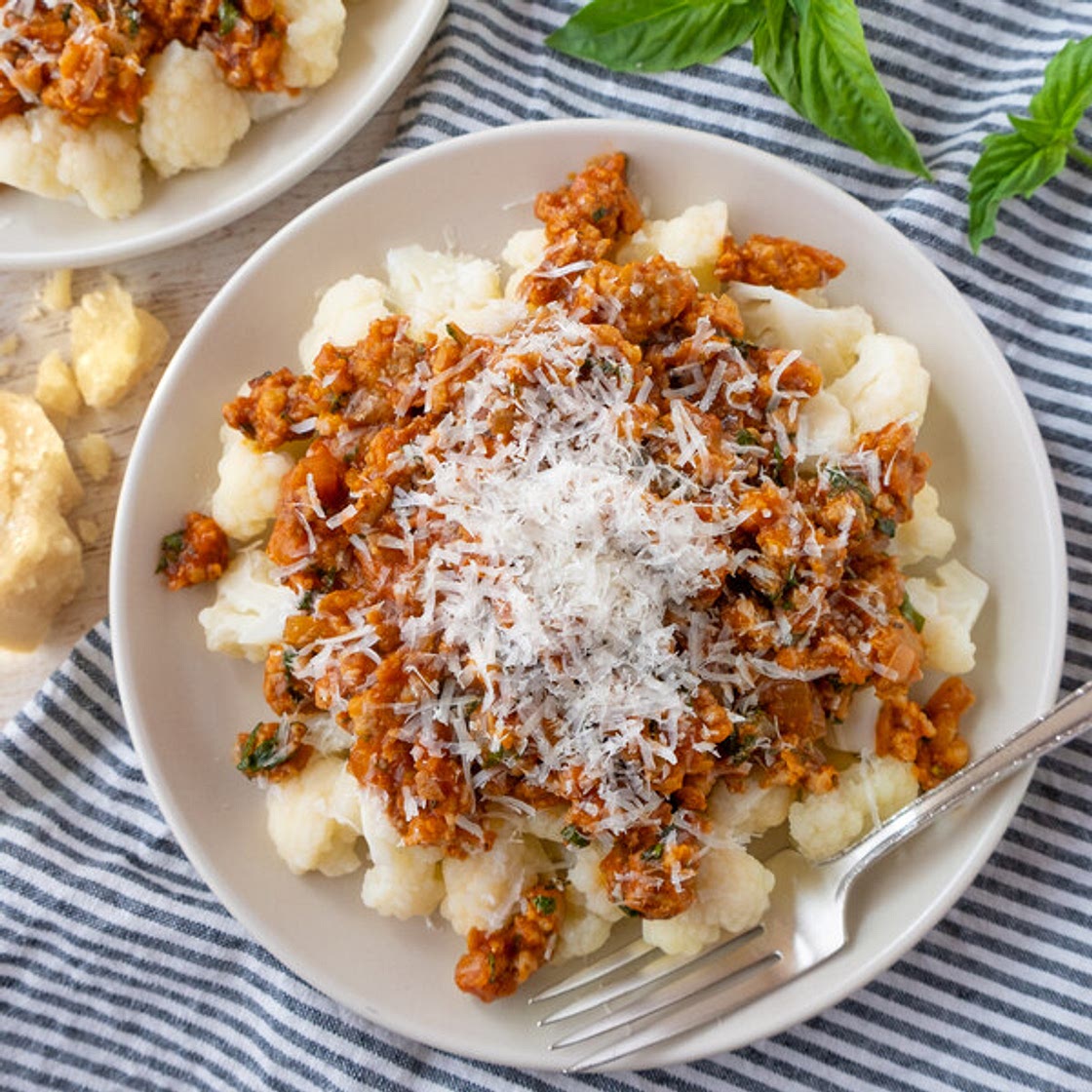 Sausage-Basil Ragù over Tender Cauliflower with Parmesan