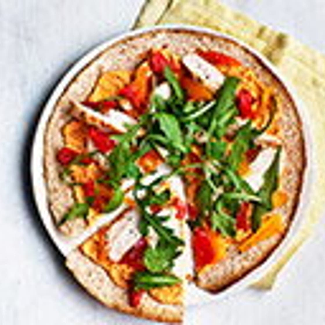 Spiced houmous and chicken 'pizzas'