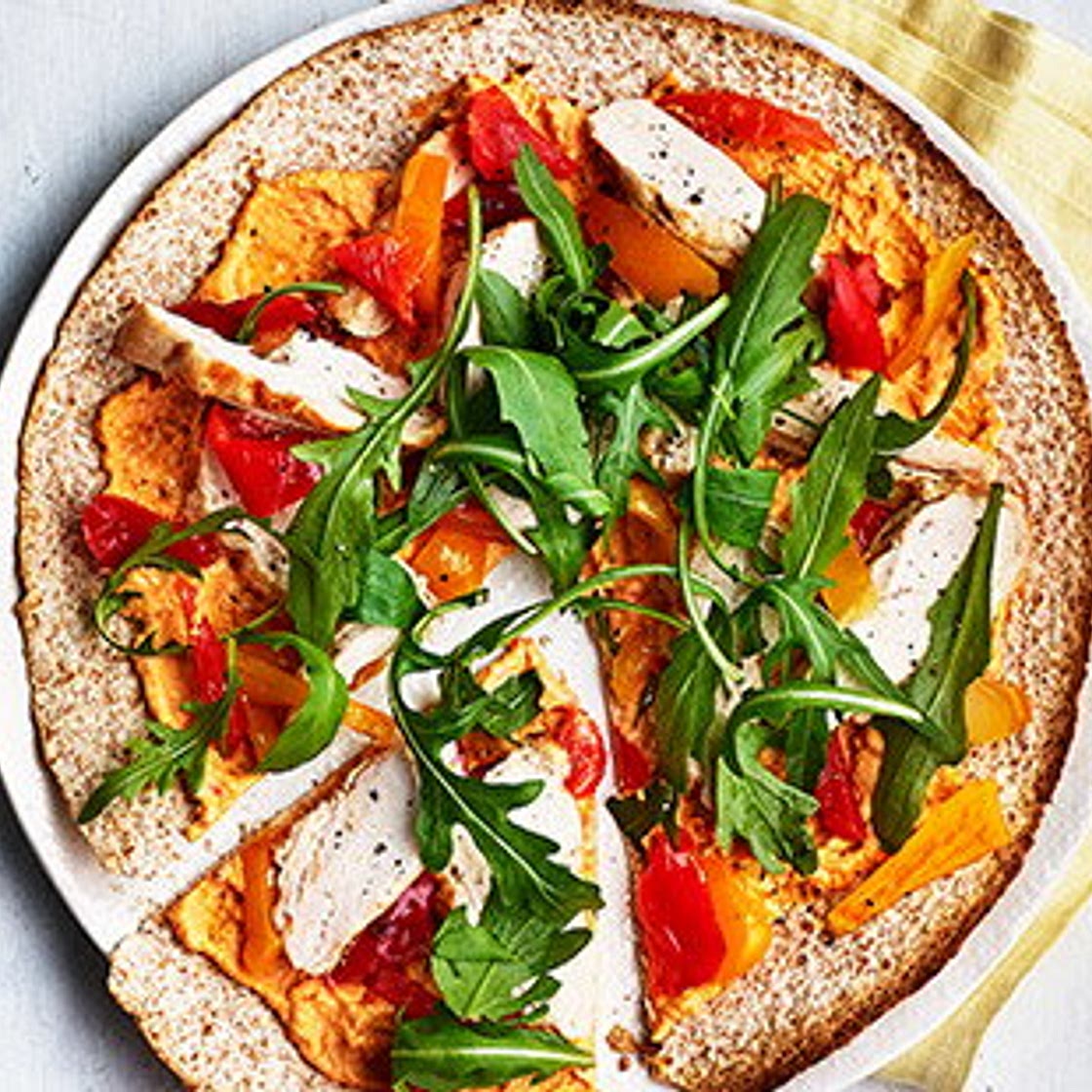 Spiced houmous and chicken 'pizzas'
