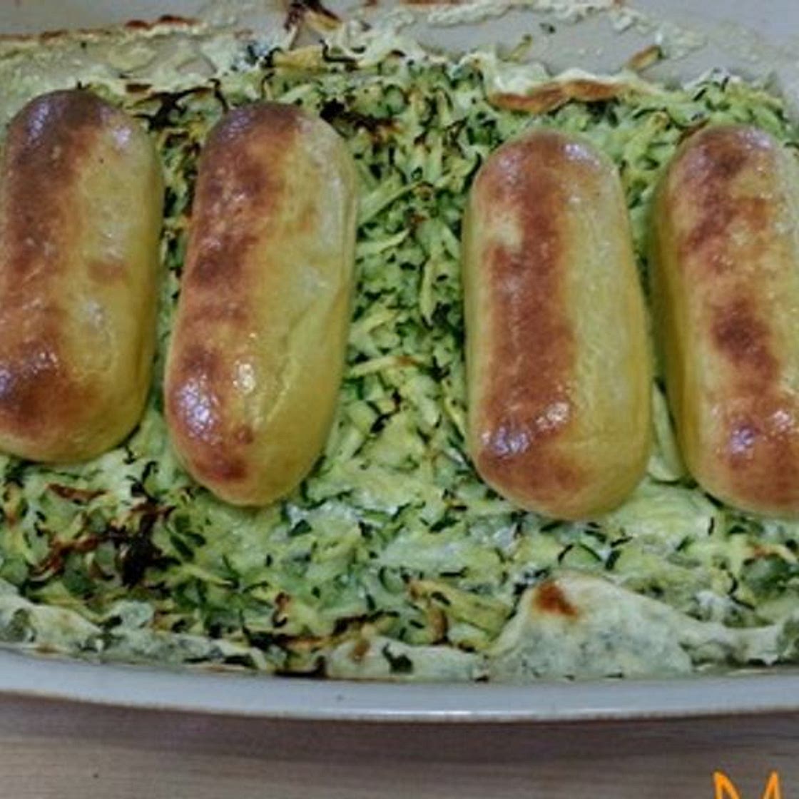 Quenelles sur lit de courgettes