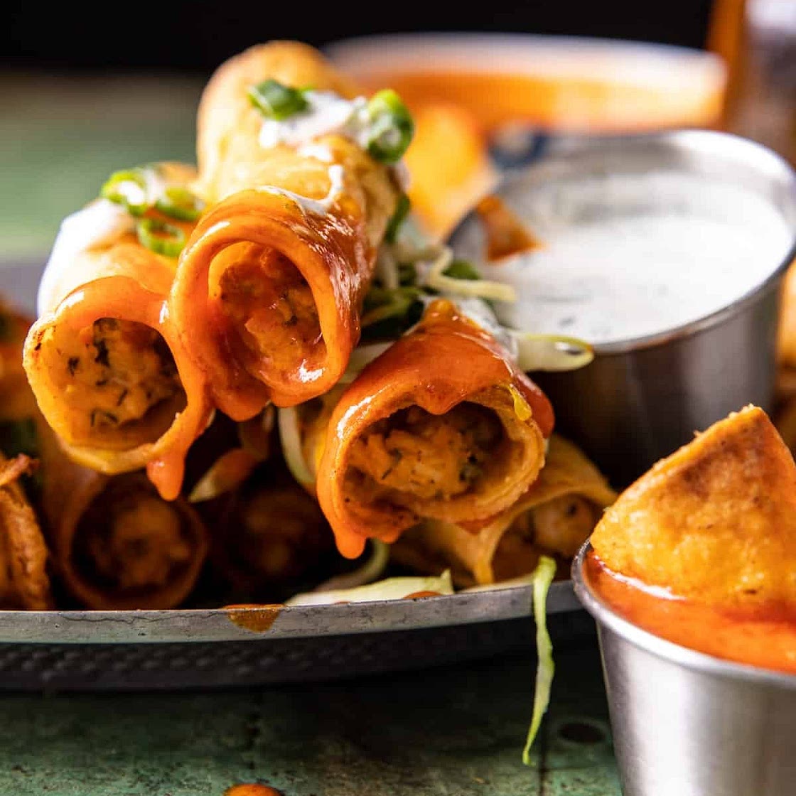 Jalapeño Cream Cheese Chicken Taquitos with Buffalo Sauce