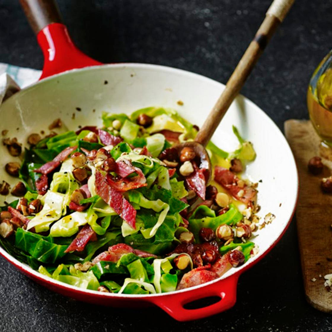 Greens with bacon and hazelnuts
