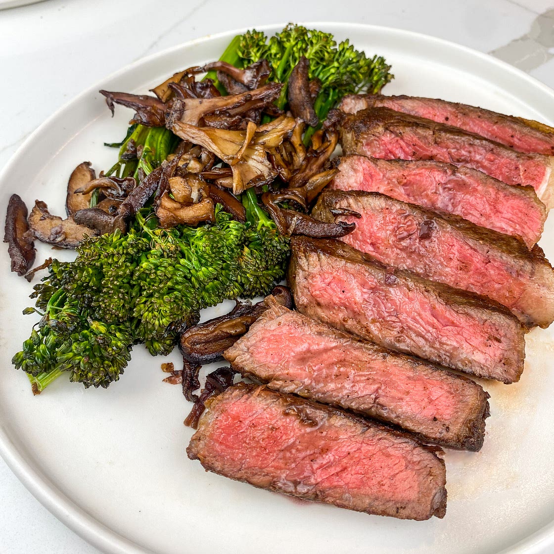 Pan-Seared New York Strip Steak with Red Wine Glazed Mushrooms