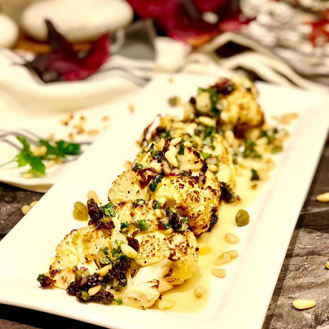 Seriously good chunky roasted cauliflower with capers and raisins dressing
