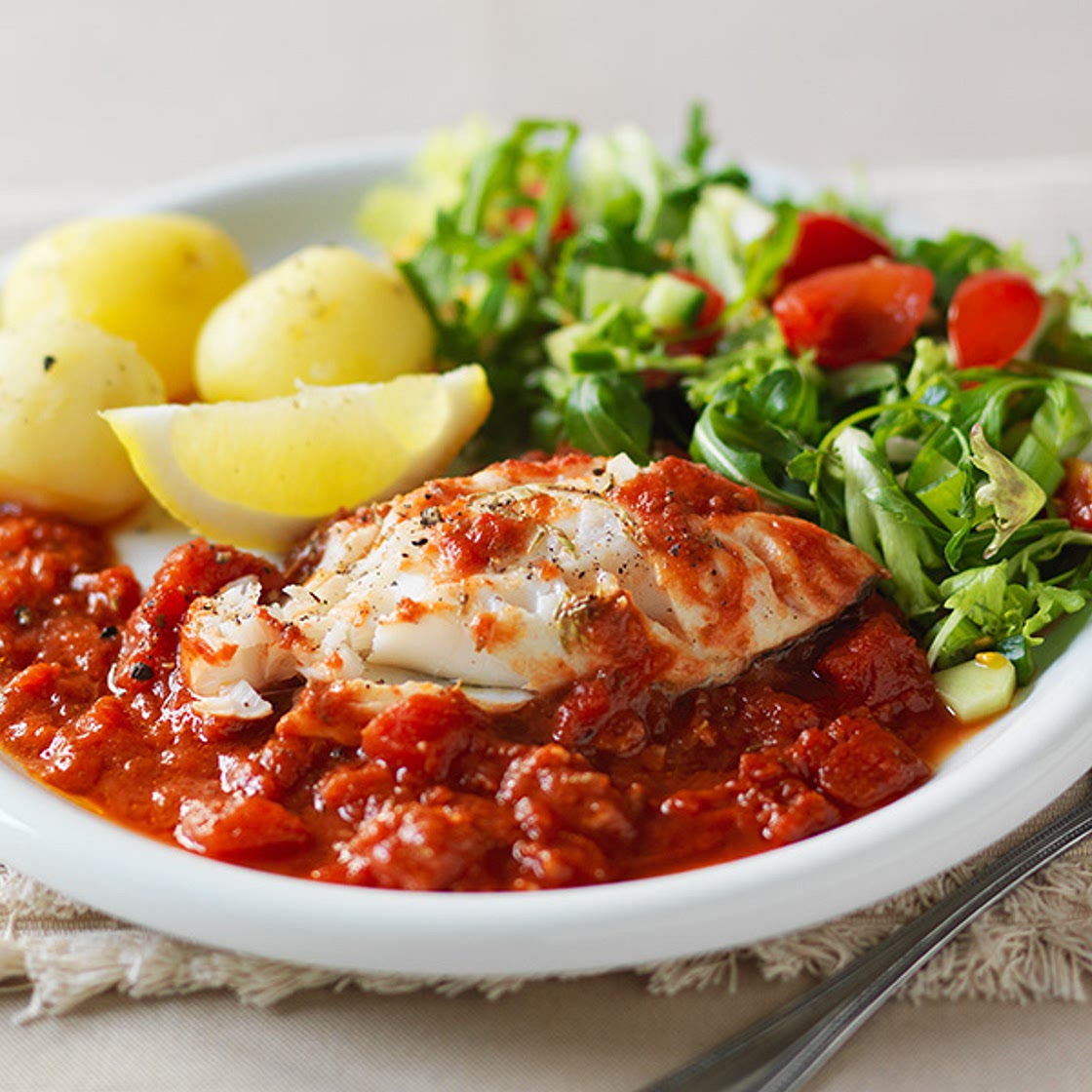 Cod Portugaise with boiled new potatoes and side salad