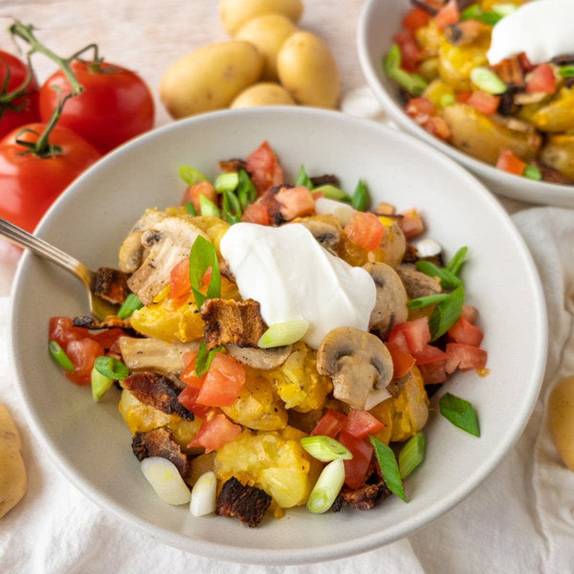 Cheesy Smashed Potatoes with Bacon, Mushrooms, Tomato & Green Onion
