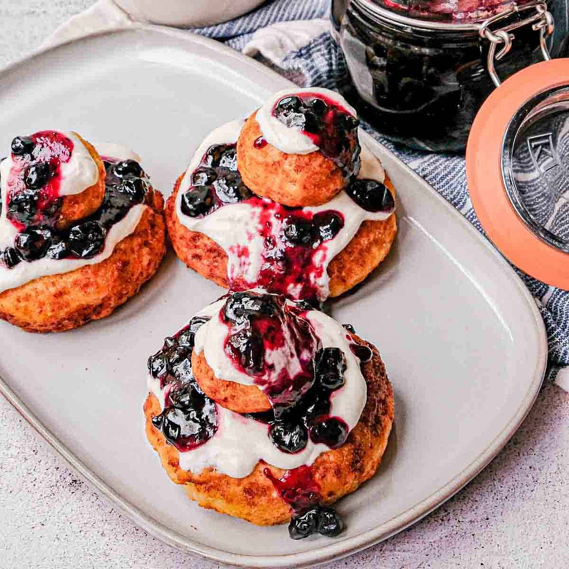 Papanasi: Sweet Cheese Donuts with Blueberry & Cream