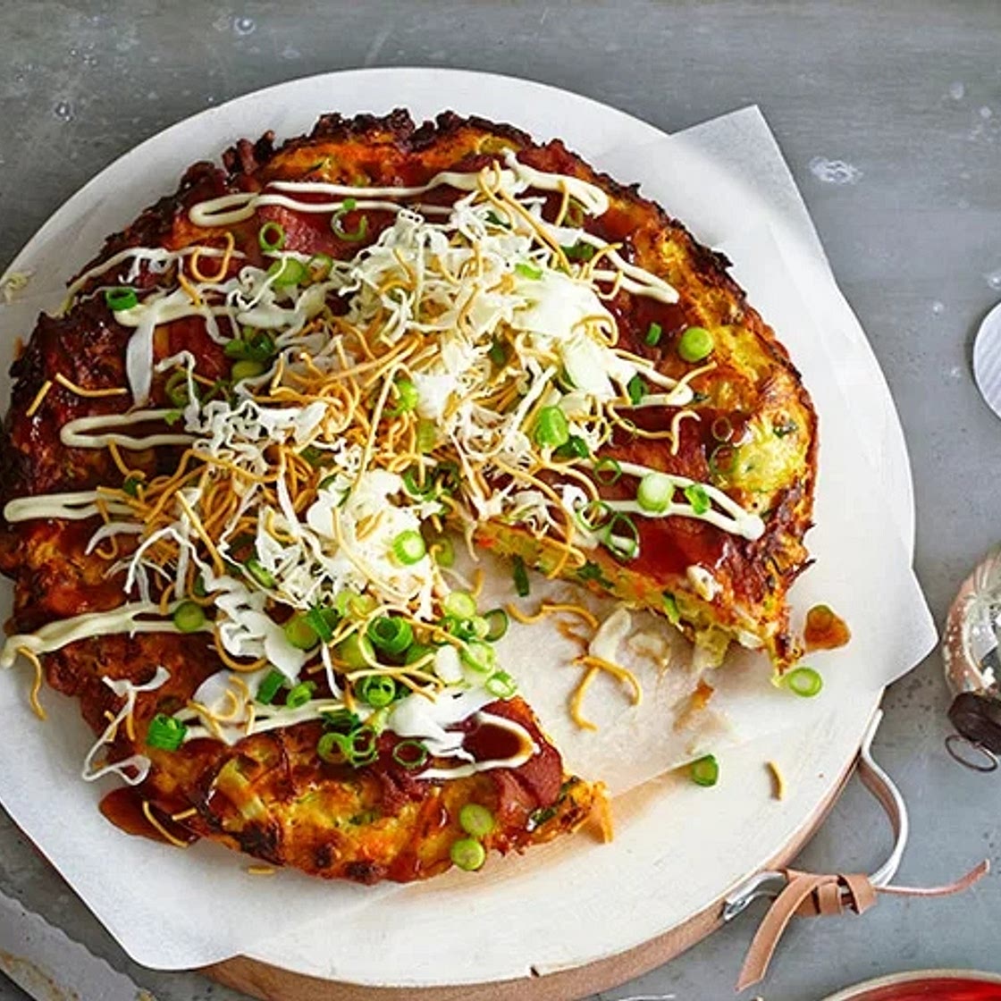 Okonomiyaki with shredded cabbage, daikon and fried noodles