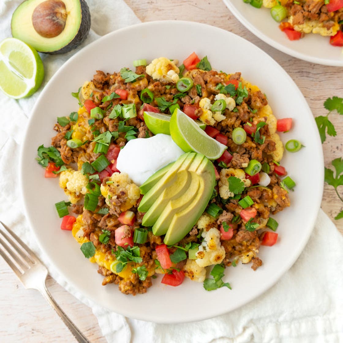 Cheesy Cauliflower Nacho Bites with Turkey, Cilantro, Avocado & Yogurt