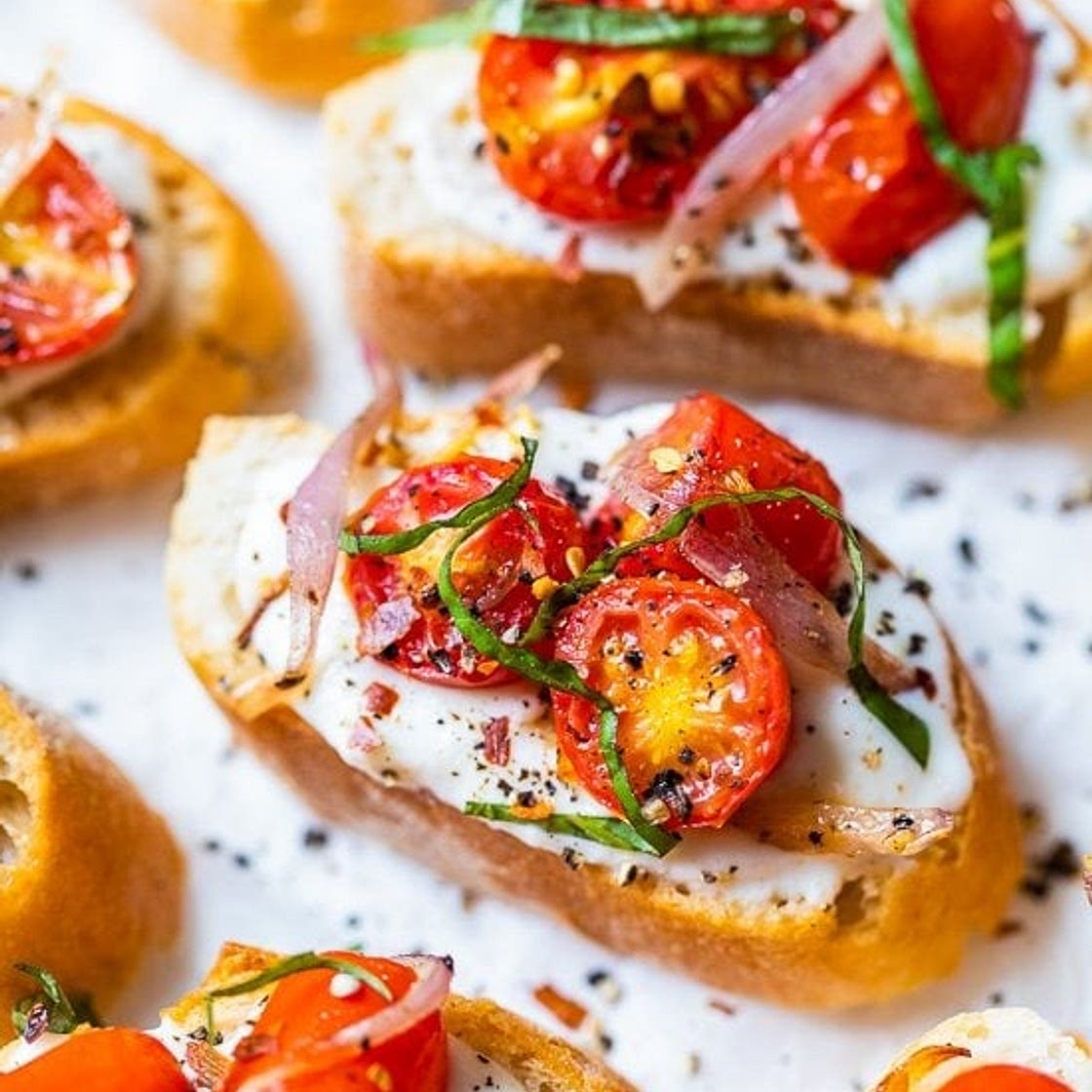 Whipped Ricotta Toast with Roasted Garlic, Tomatoes and Shallots