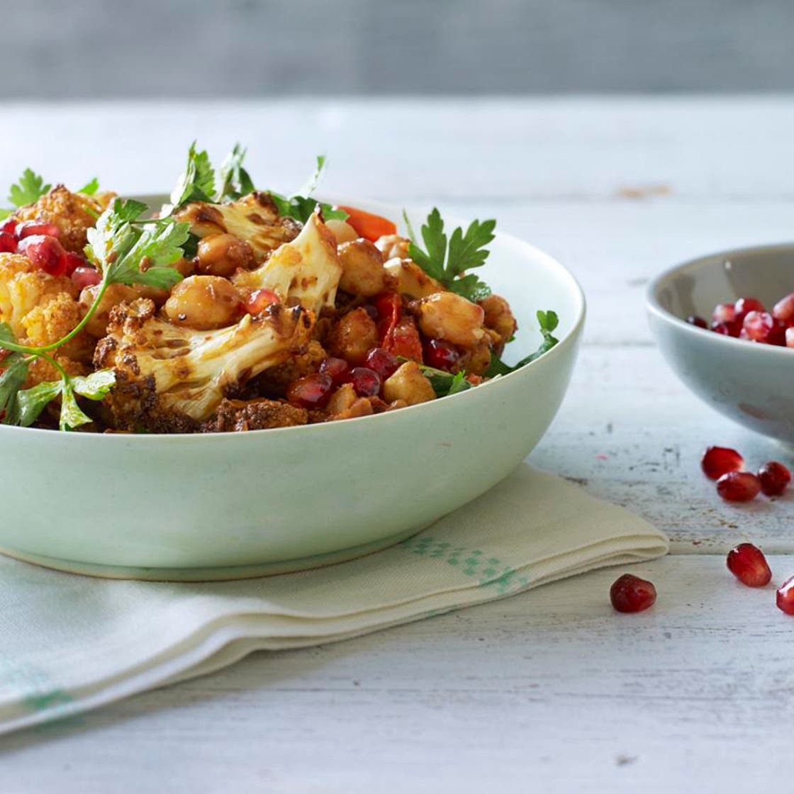 Warm spiced cauliflower and chickpea salad with pomegranate seeds