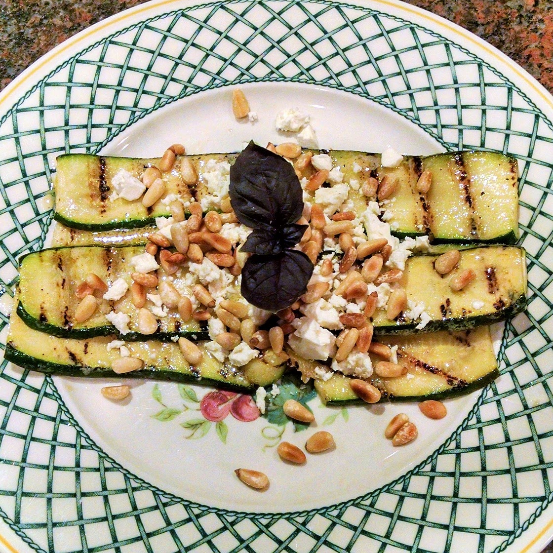 Grilled zucchini with feta and pine nuts