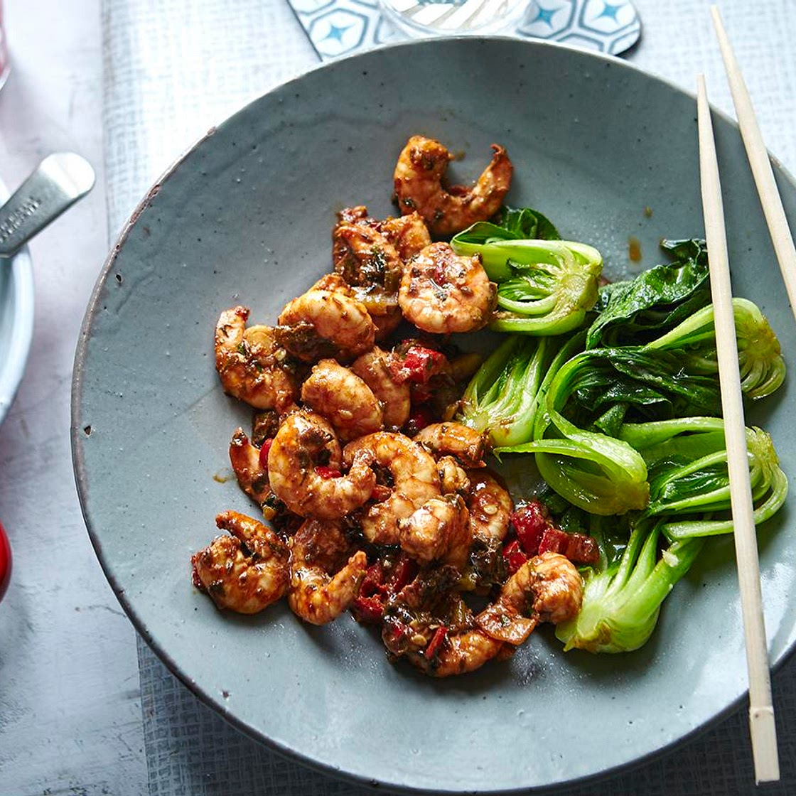 Firecracker prawns with stir-fried greens