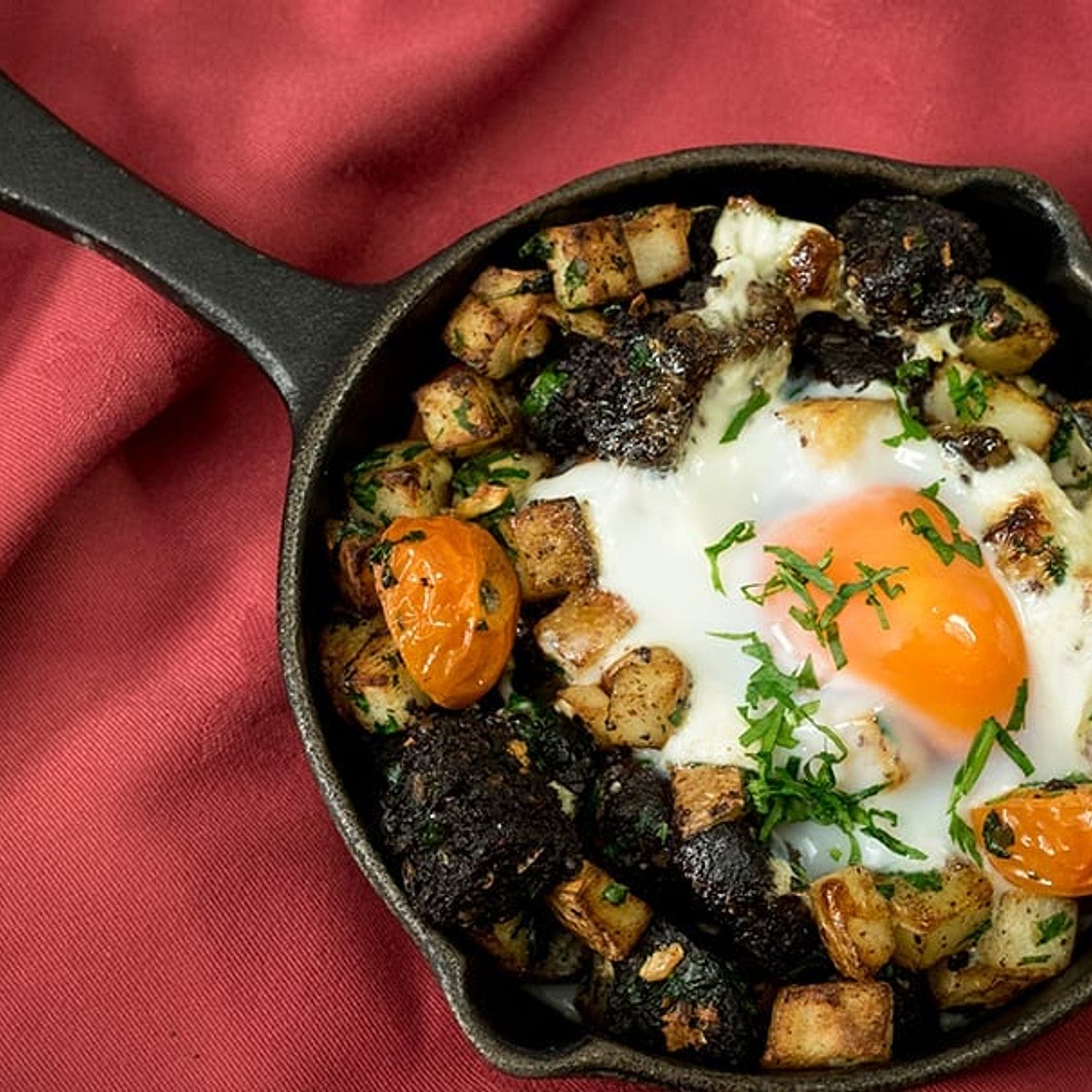 Black pudding, diced garlic potatoes, baked eggs brunch