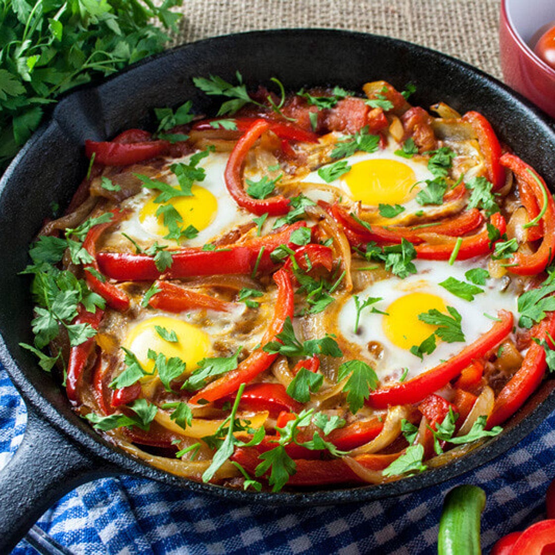Baked Eggs Skillet With Red Peppers And Onions