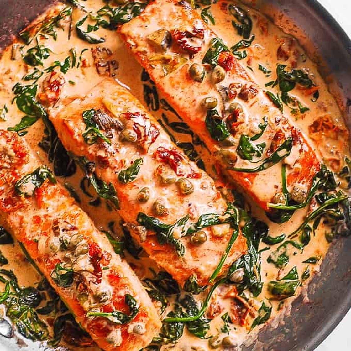 Creamy Tuscan Salmon with Spinach, Artichokes, and Garlic