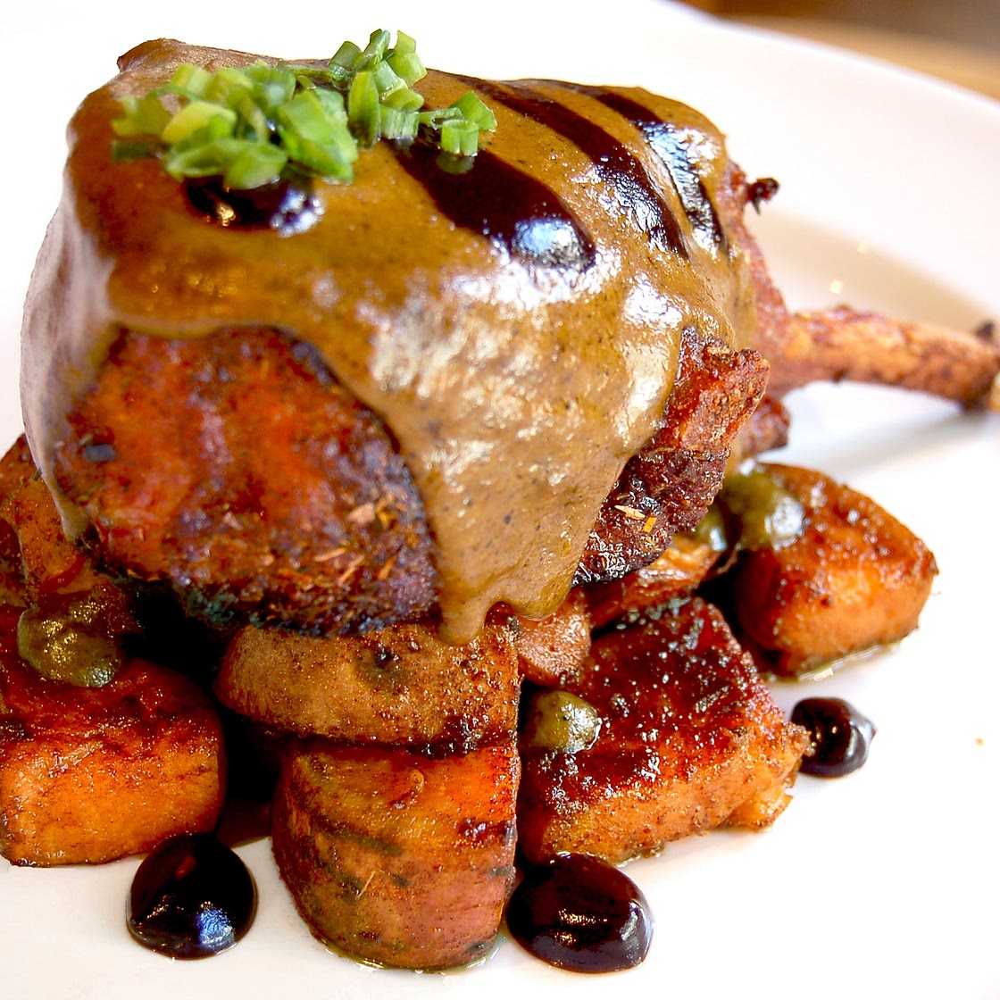 Double Cut Pork Chops with Tamarind Glaze, Green Mole Sauce and Caramelized Sweet Potatoes