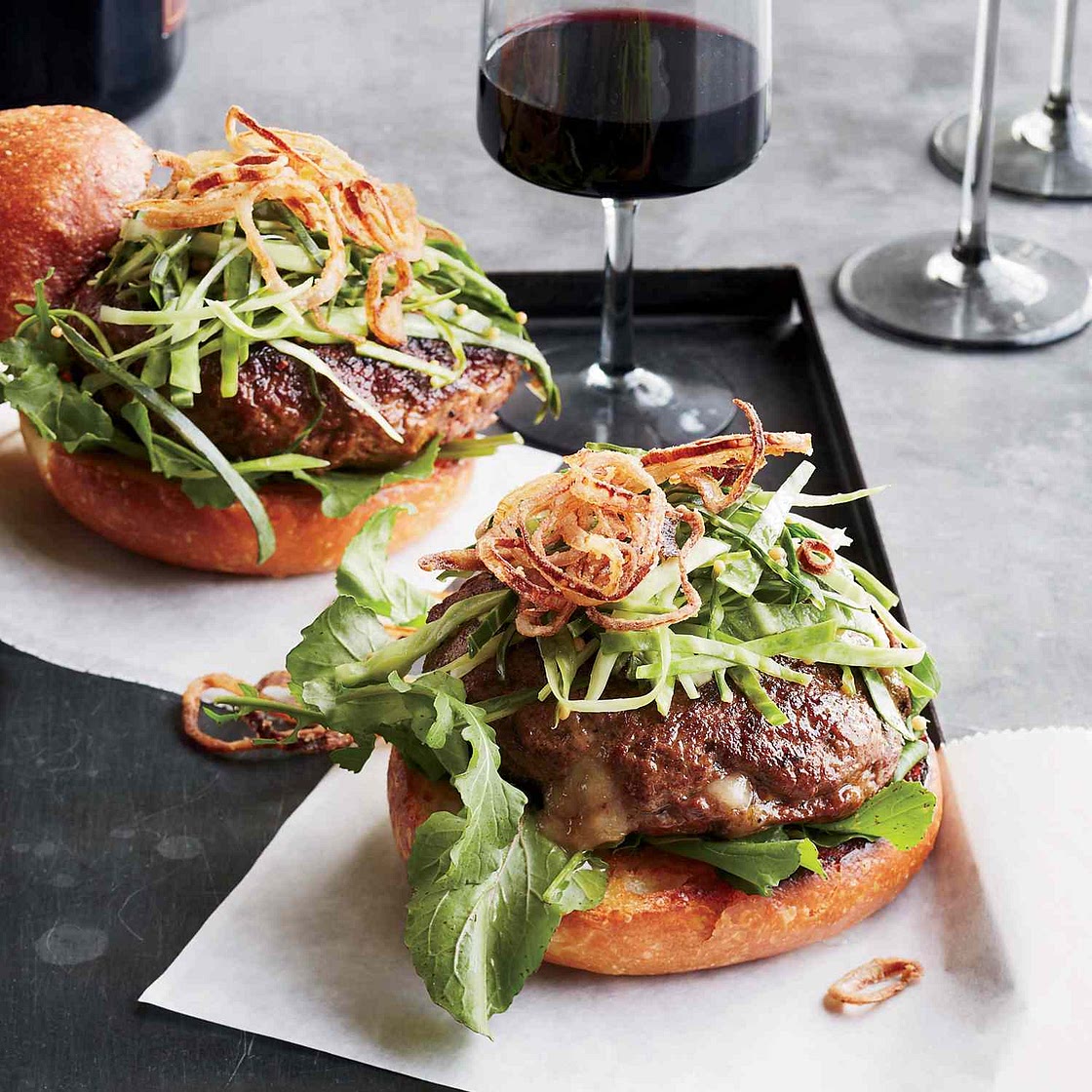 Cheddar-Stuffed Burgers with Pickled Slaw and Fried Shallots