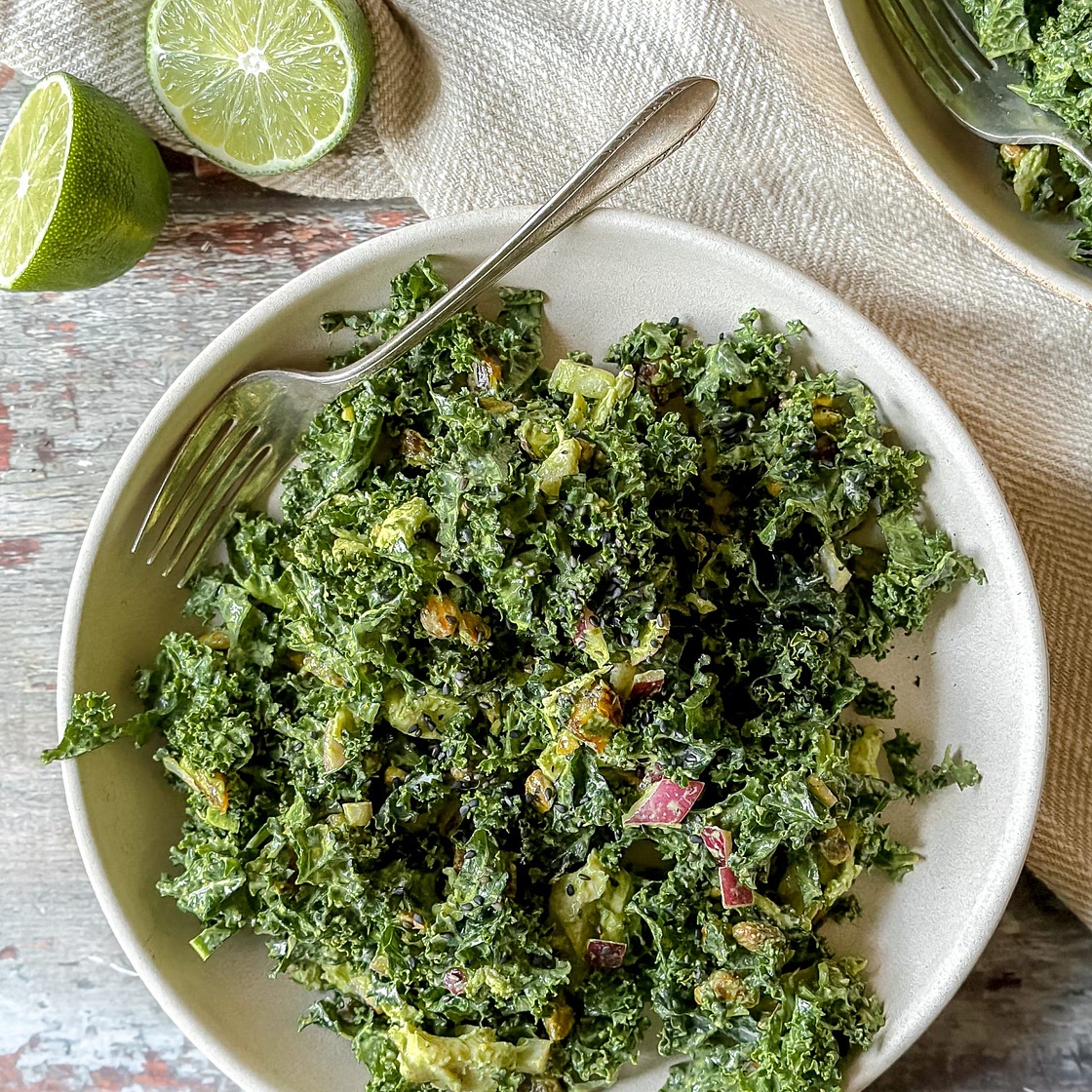 Kale Salad with tahini and herb dressing, dates, pistachios and poached chicken