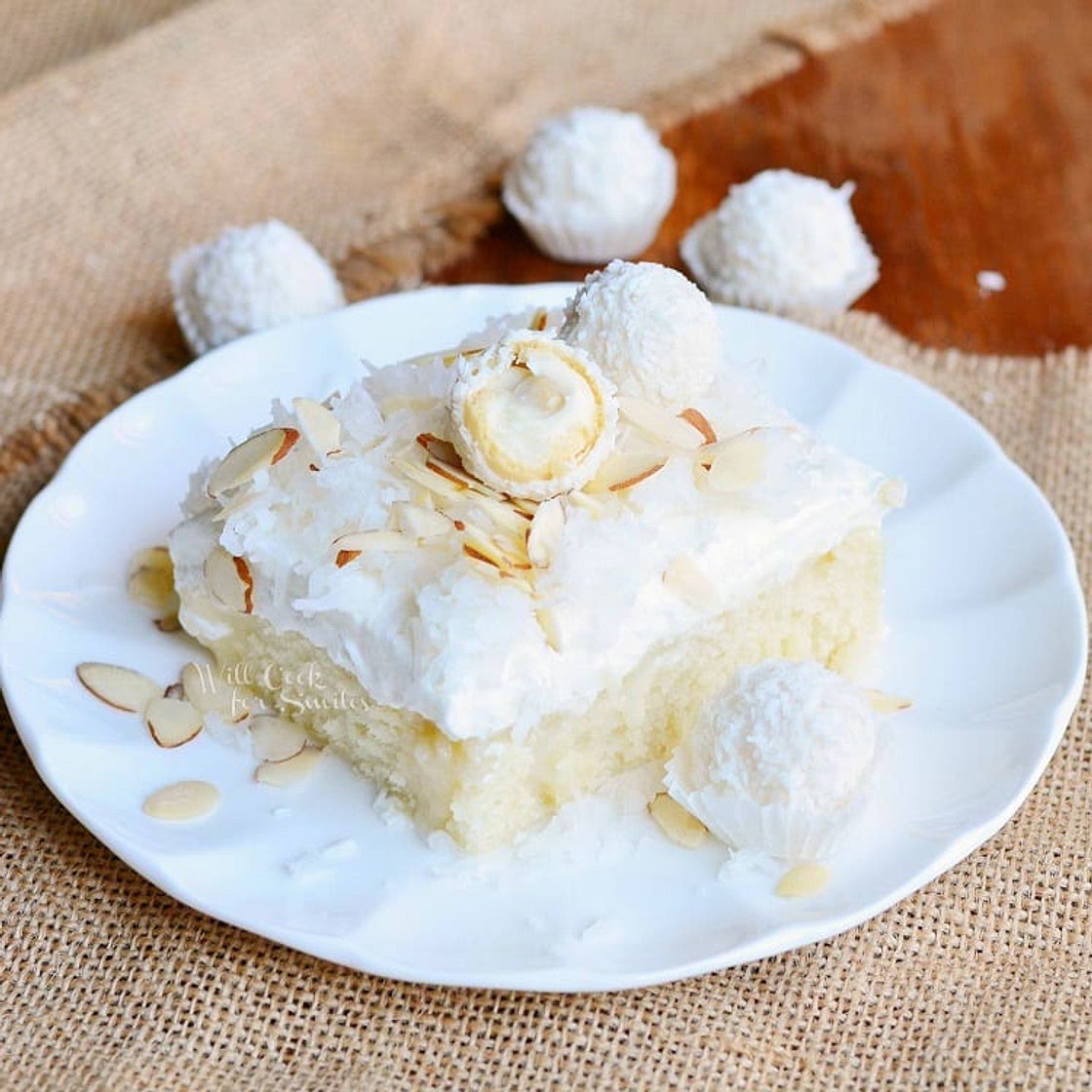 Raffaello Poke Cake: Coconut Cake with White Chocolate/Coconut Cream & Whipped Topping