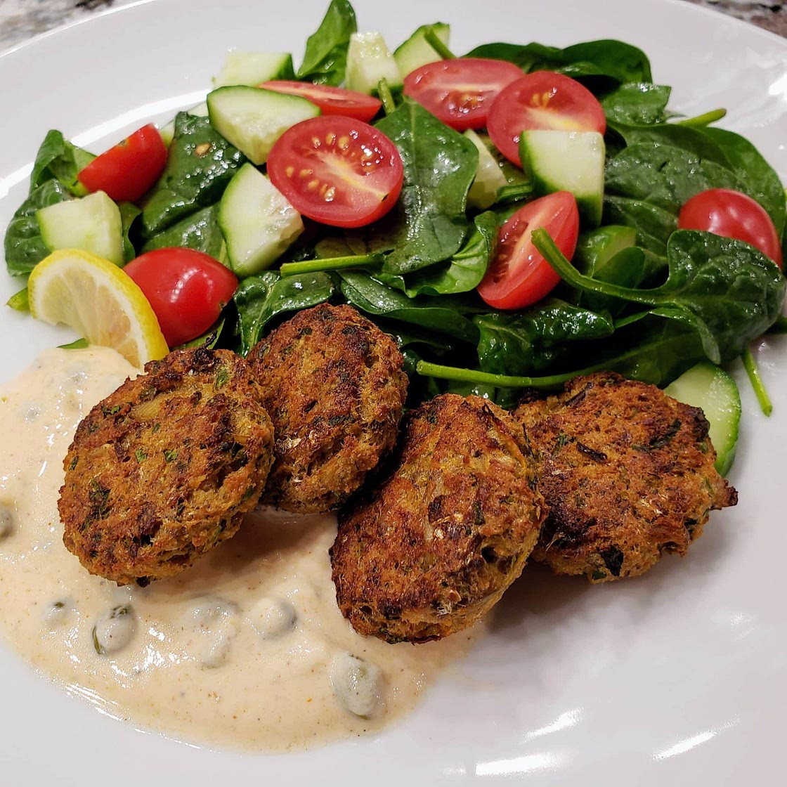 Sardine cakes with spicy yogurt sauce