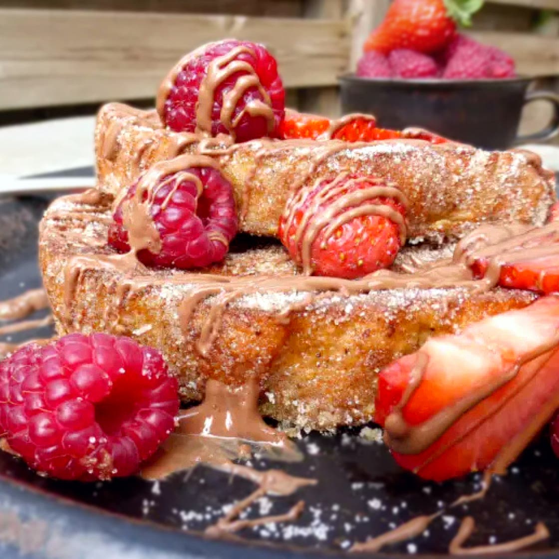 Churro French Toast (with milk chocolate, strawberries & raspberries)