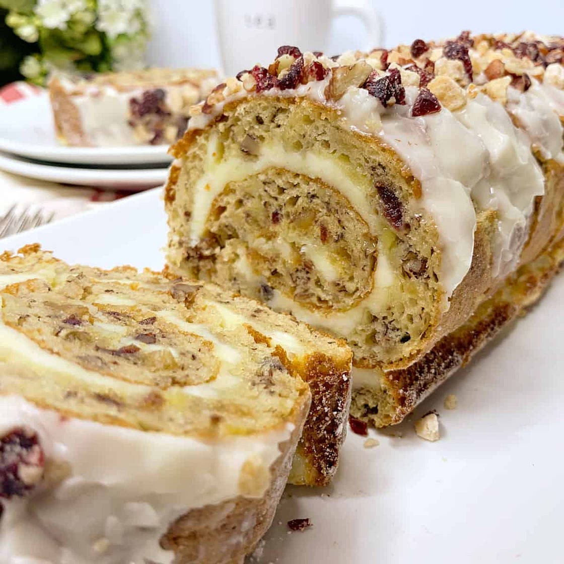 Banana Cream Cheese Cake Roll with Pecans Cranberries and Ginger