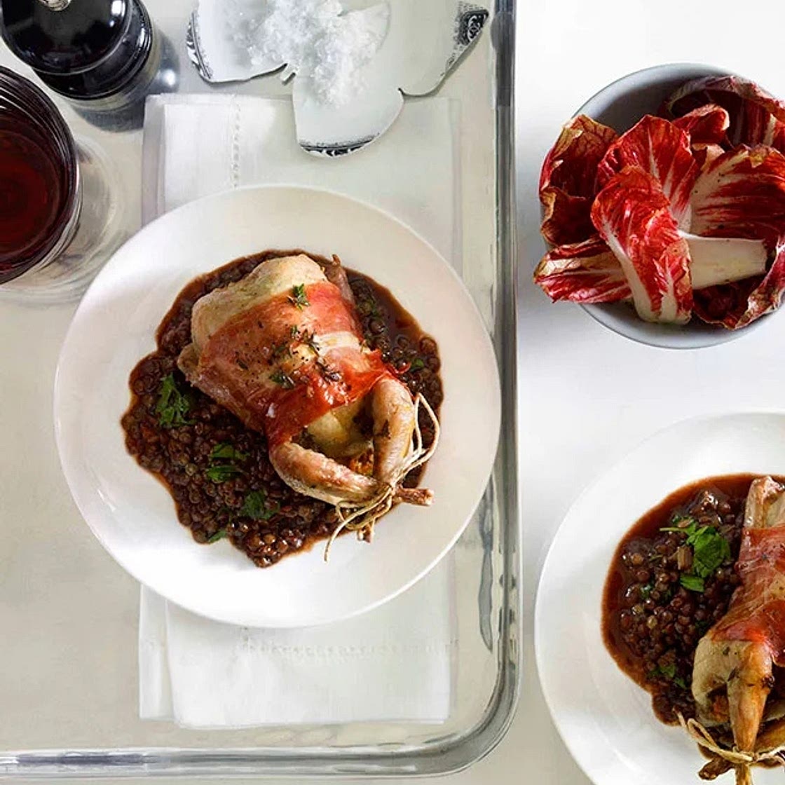 Thyme-roast quail with prosciutto and red wine lentils