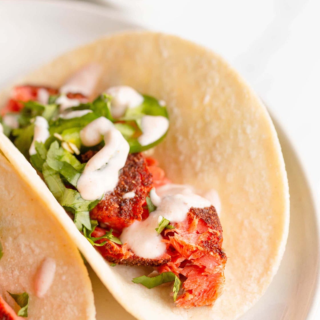 Salmon Tacos with Sriracha Cream Sauce