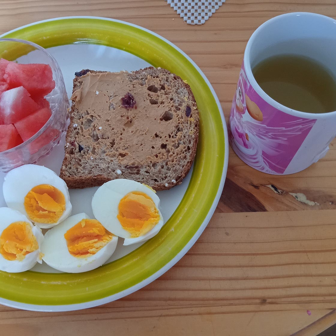 Boiled eggs with watermelon and peanut butter toast
