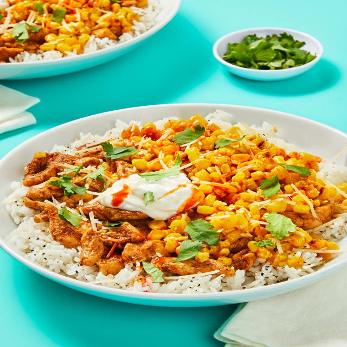 Taqueria Chicken Bowls with Corn Esquites, Sour Cream, Hot Sauce & Cilantro