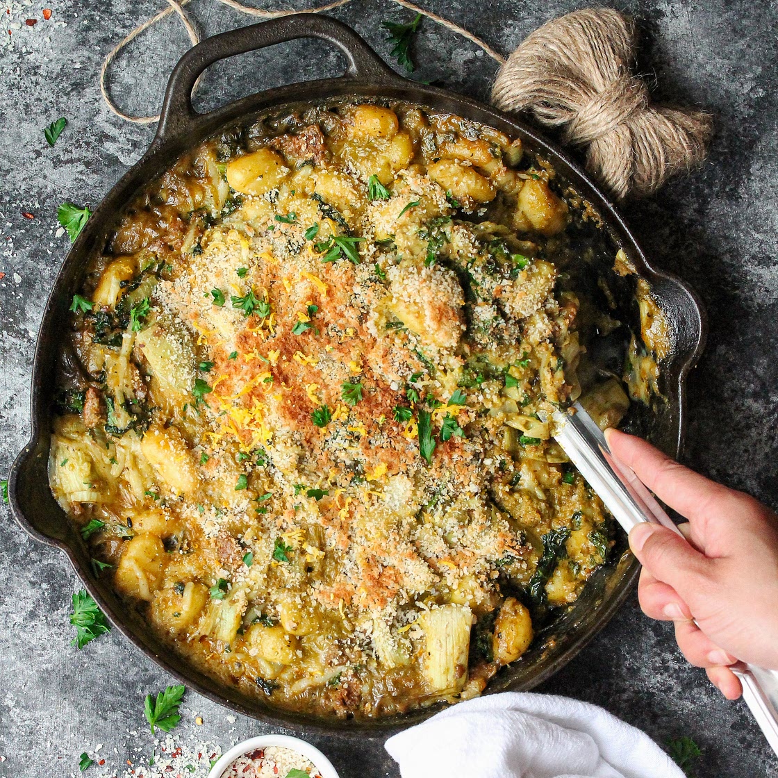 Skillet Baked Vegan Sausage, Kale and Artichoke Gnocchi with Pistachio Pesto