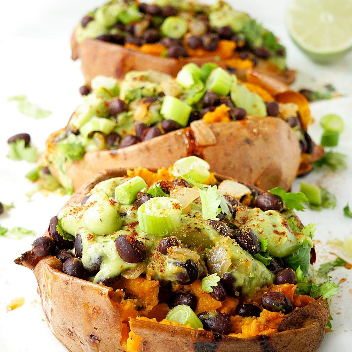 Black Bean Stuffed Sweet Potatoes with Avocado Creme