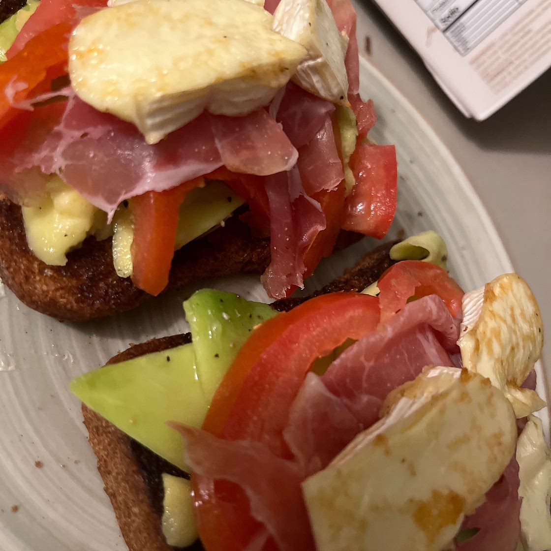 Avocado toast with tomatos and burrata.