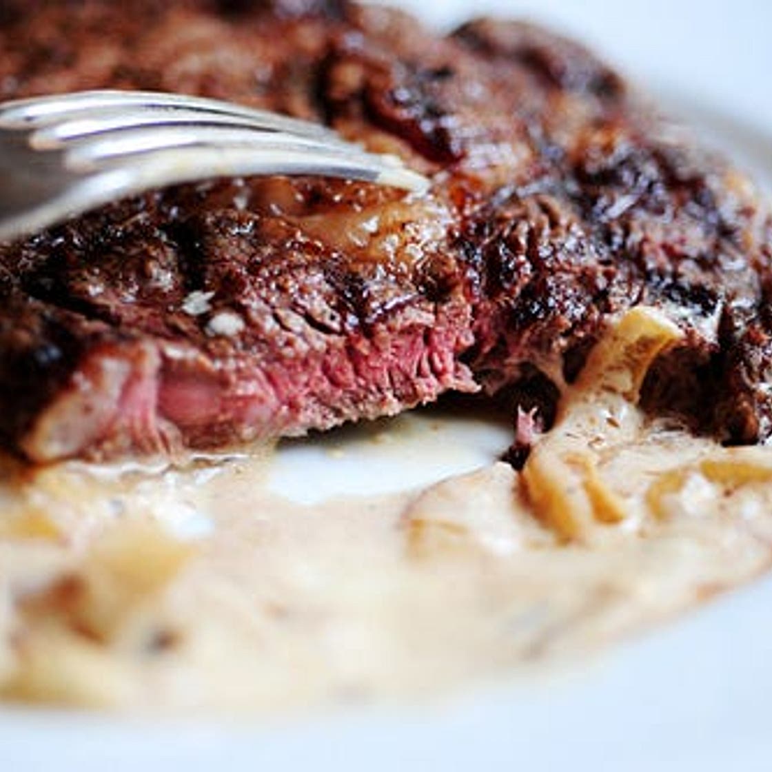 Grilled Ribeye Steak with Onion-Blue Cheese Sauce