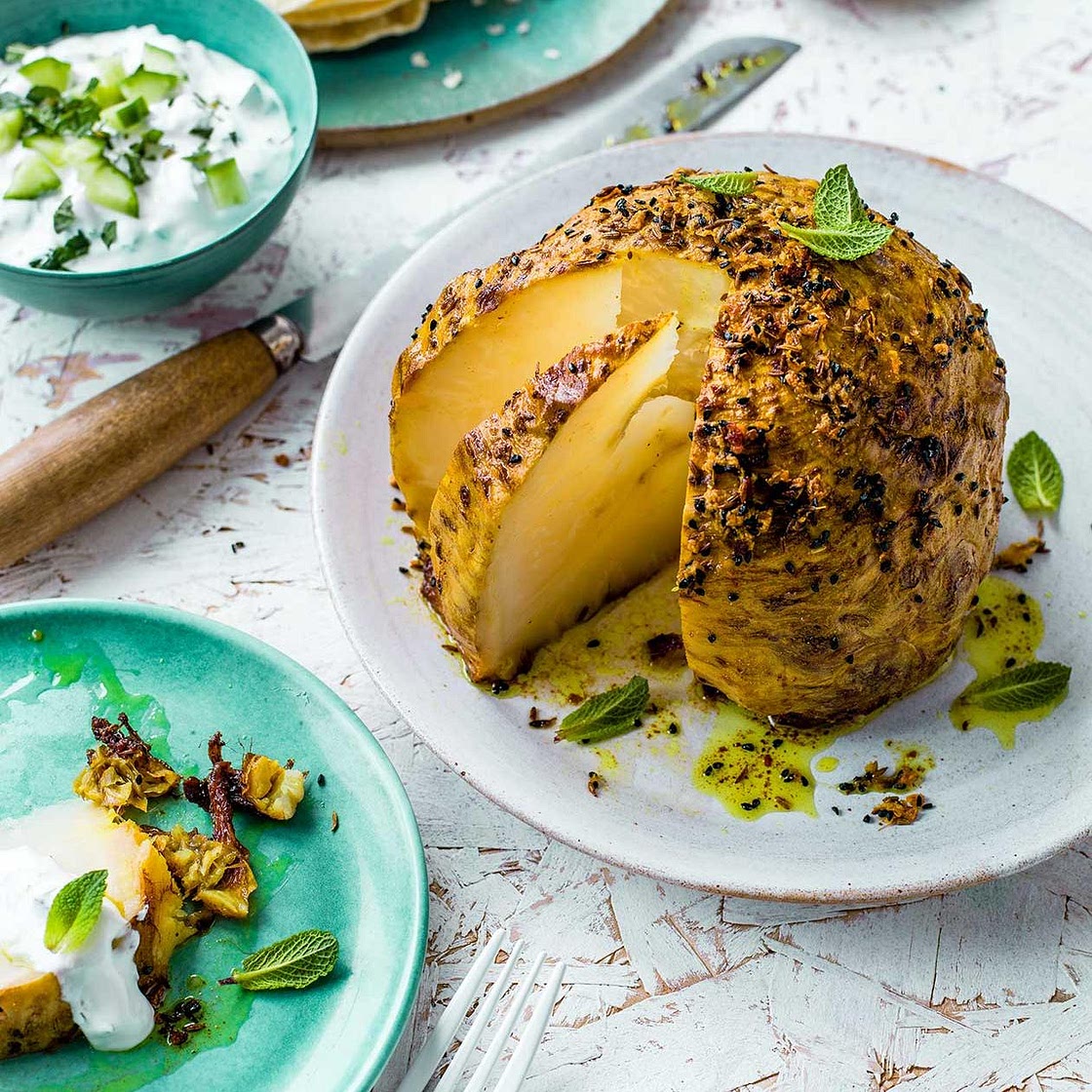 Slow-roast spiced whole celeriac with raita