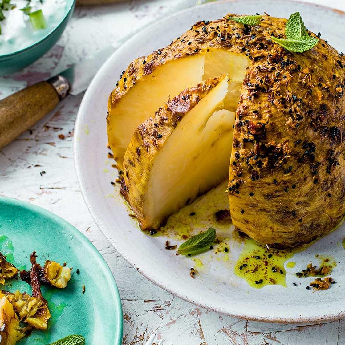 Slow-roast spiced whole celeriac with raita
