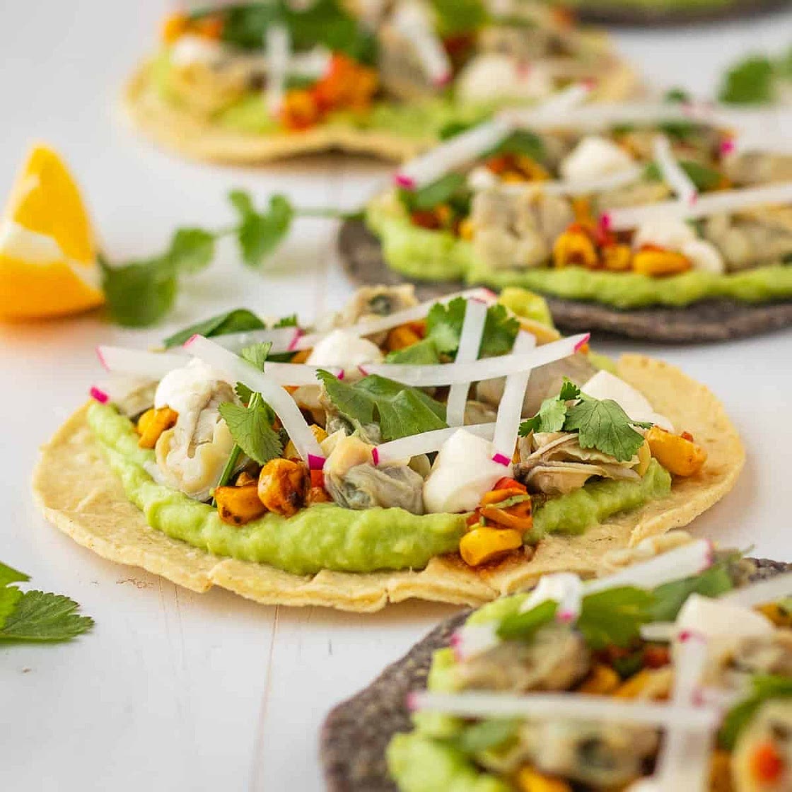 Clam and avocado tostadas