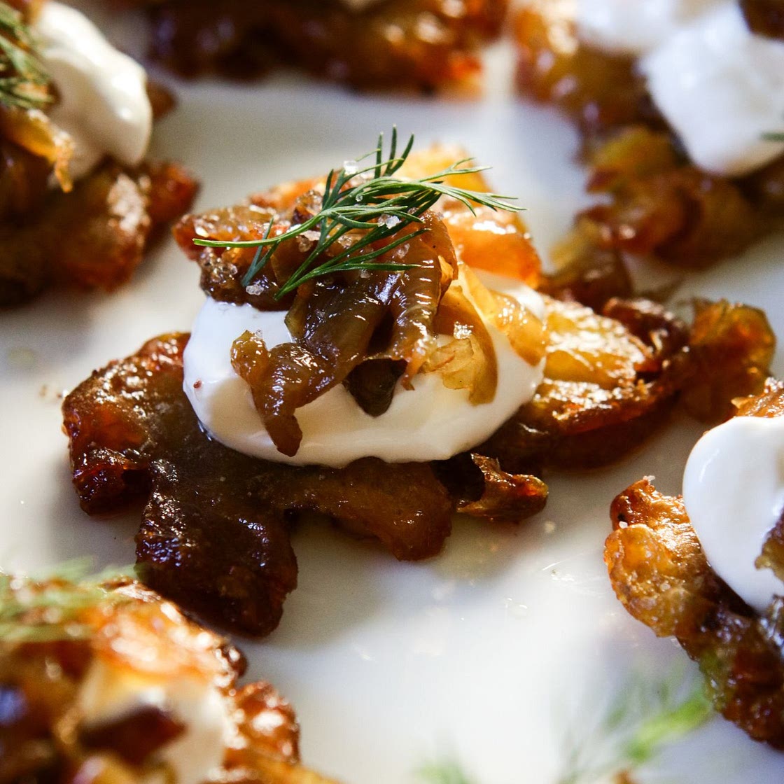 Crispy Smashed Potatoes with Sour Cream and Jammy Caramelized Onions