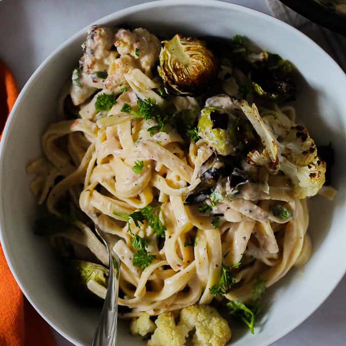 Creamy White Bean Pasta with Roasted Brussels Sprouts and Cauliflower