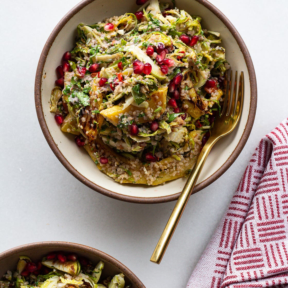 Shaved Brussels Sprouts Salad with Pomegranate Dressing & Chili Almonds