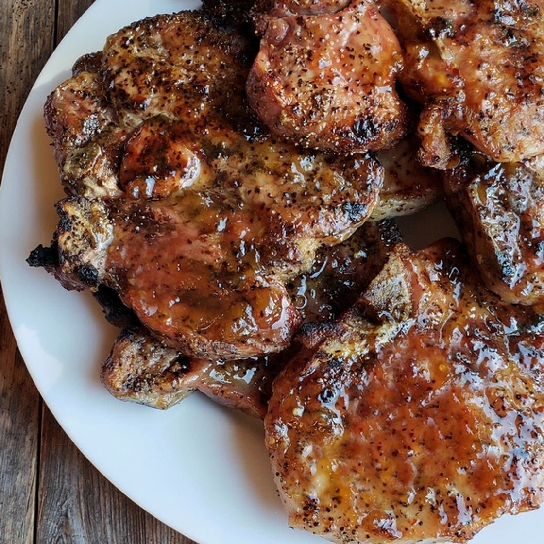 Juicy Grilled Pork Chops with Spicy Peach Glaze