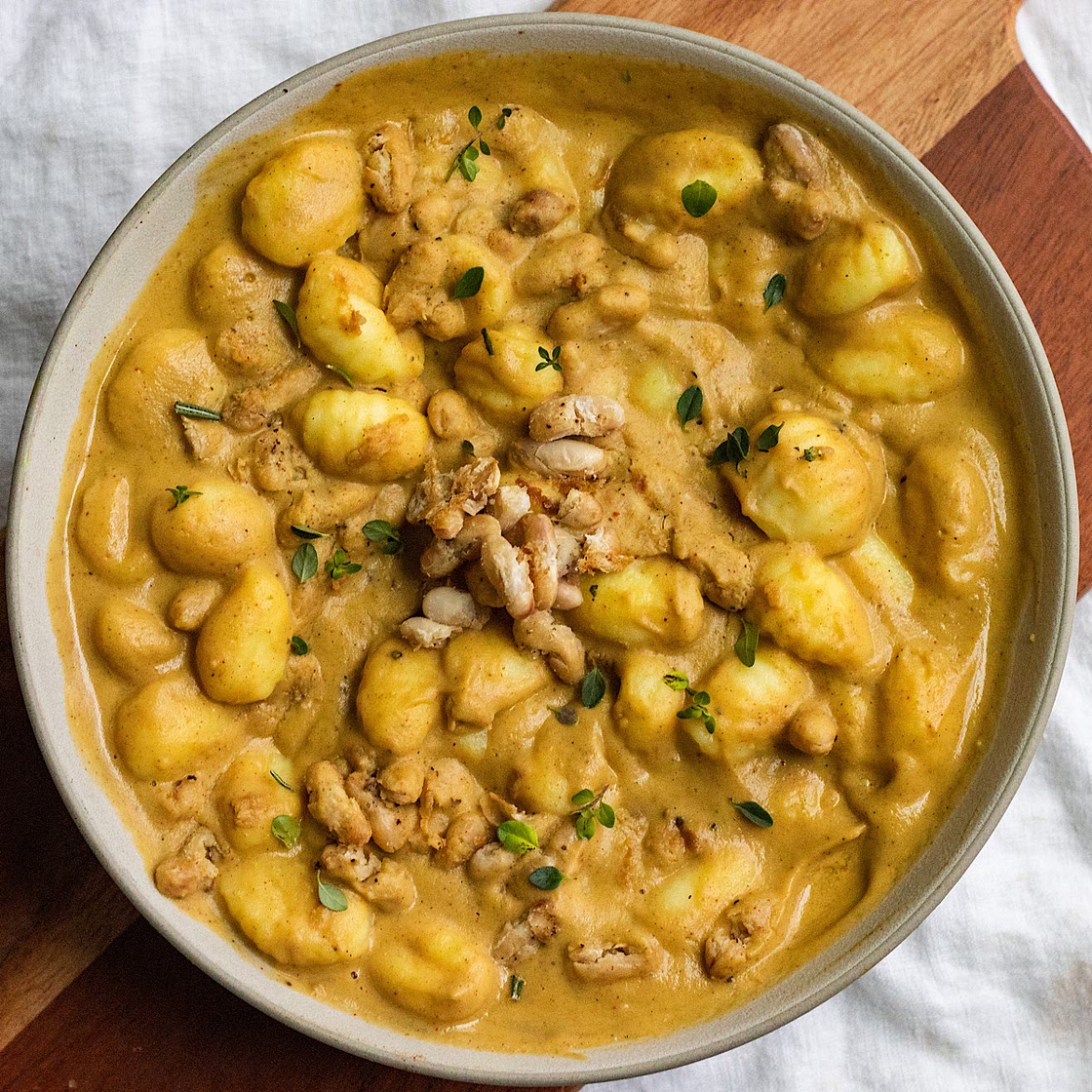 vegan creamy acorn squash gnocchi with crispy white beans