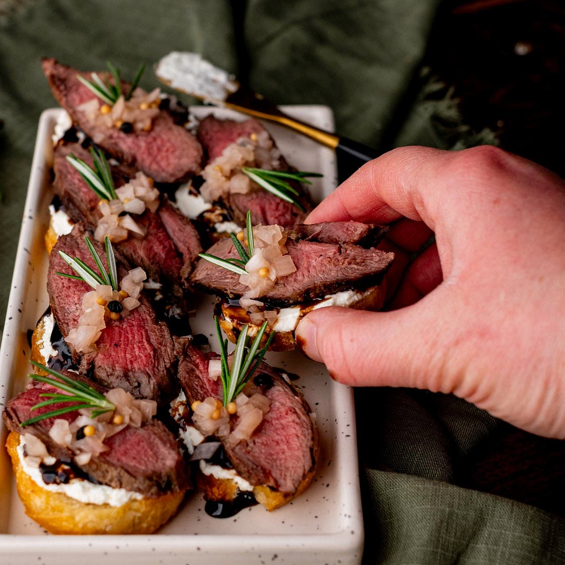 Venison Crostini with Whipped Goat Cheese & Pickled Shallots