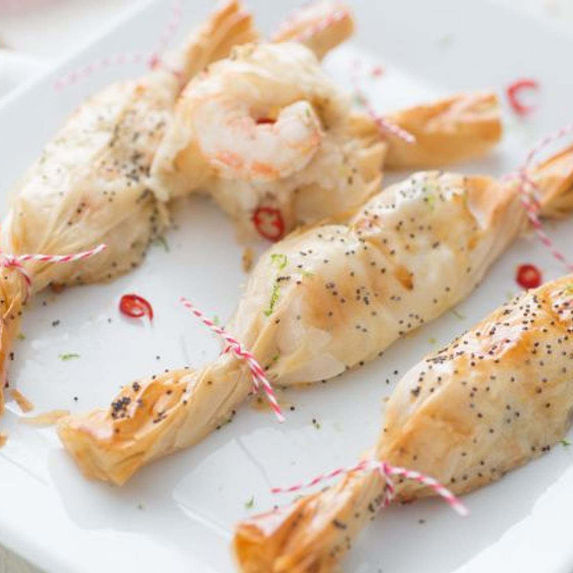 Pacchetti natalizi con scampi, zenzero e lime