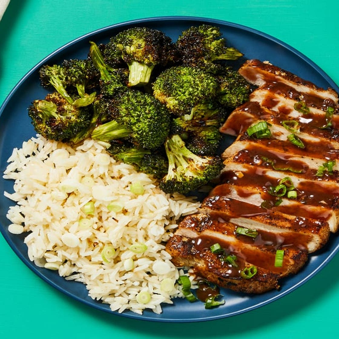 Hoisin Plum Pork Chops with Scallion Rice & Sesame Roasted Broccoli
